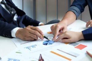 businessteam are analyzing graphs data 2024 12 06 13 26 33 CFRE5XL